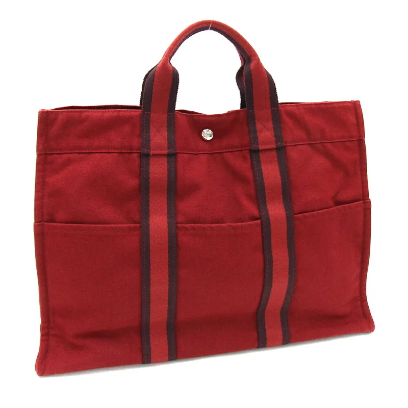 Handle bags with sturdy bases for stability -Hermes  Cotton Canvas Handbag Tote Bag (Pre-Owned)