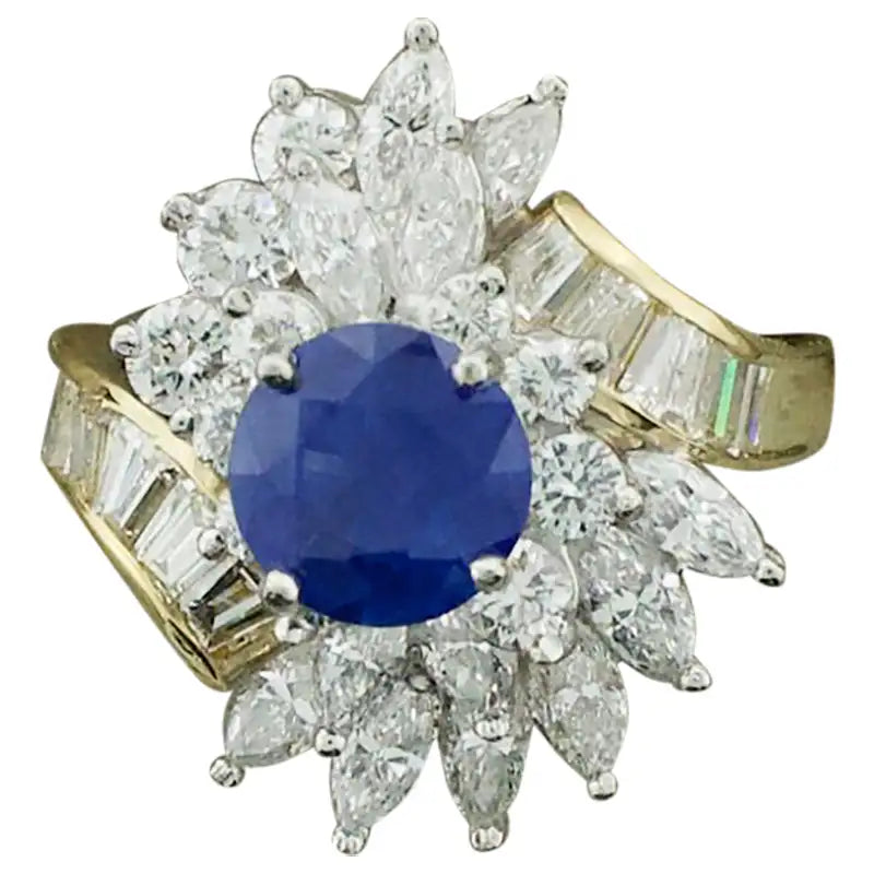 Women’s bridal rings with diamond halo settings -Sapphire and Diamond Cocktail Ring by Terrell & Zimmelman, circa 1970s