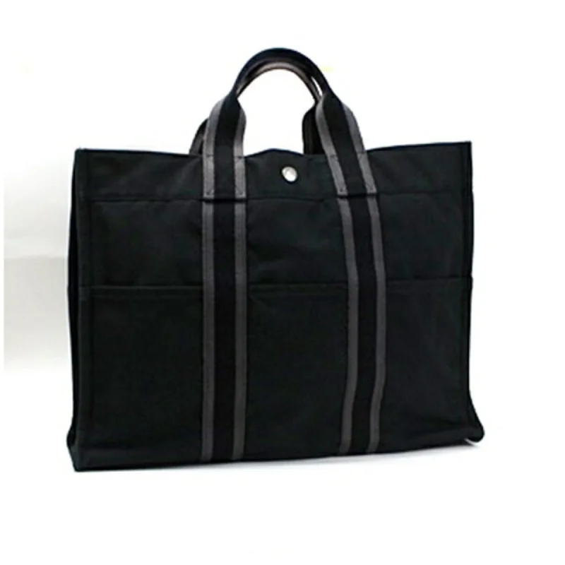 Handle bags with detachable pouches for versatility -Hermes  Canvas Tote Bag (Pre-Owned)