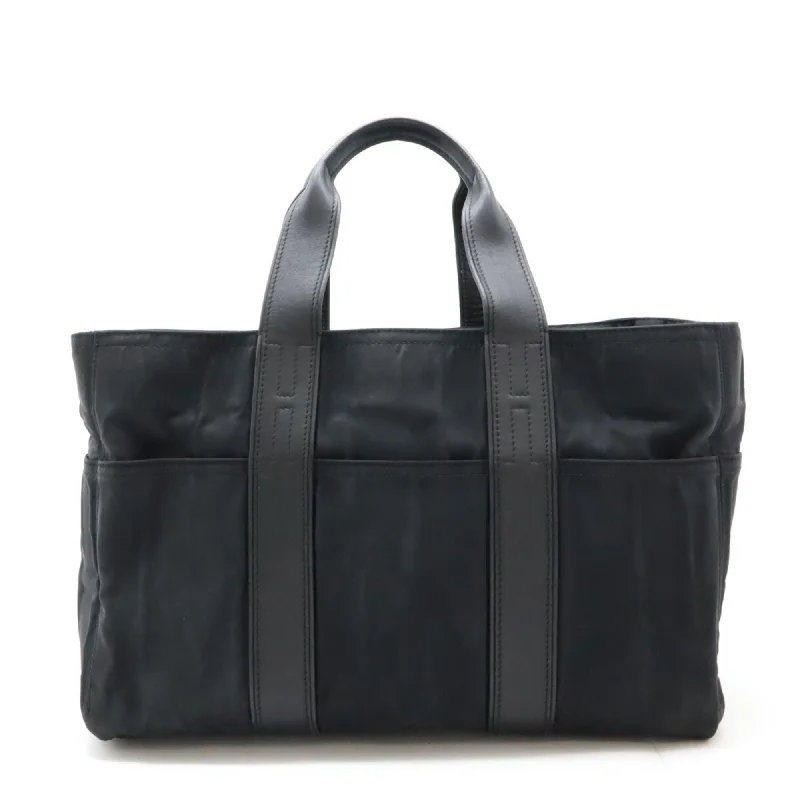 Handle bags with modern cutouts for style -Hermes  Nylon Leather Handbag Tote Bag (Pre-Owned)