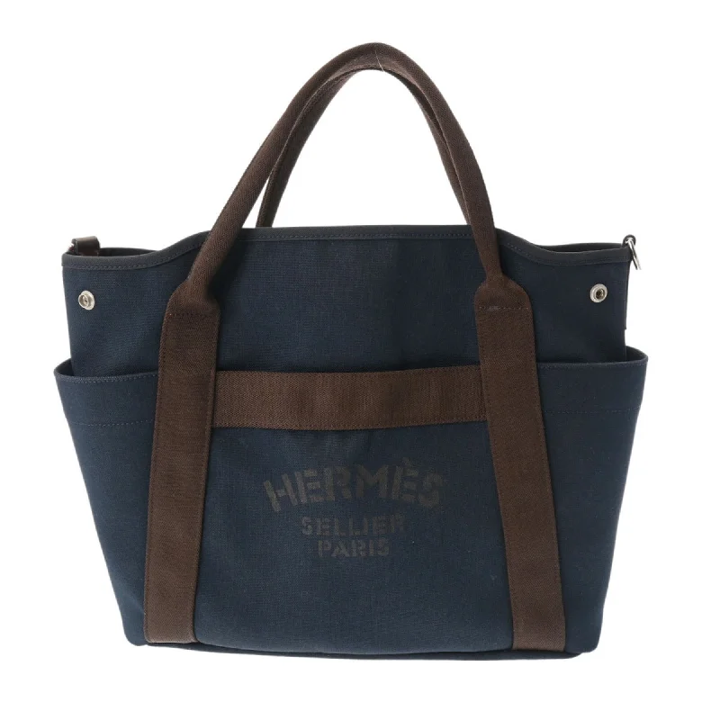 Handle bags with suede accents for texture -Hermes  Navy  Canvas Tote Bag (Pre-Owned)