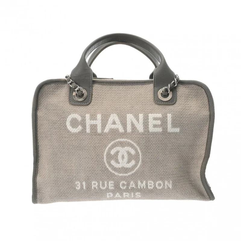 Handle bags with hidden pockets for security -Chanel  Canvas Leather Tote Bag (Pre-Owned)