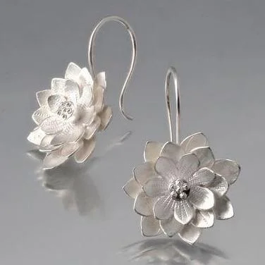 Best hoop earrings with crescent-shaped designs for a bold, moon-inspired style-Lotus Sterling Silver Loop Earrings