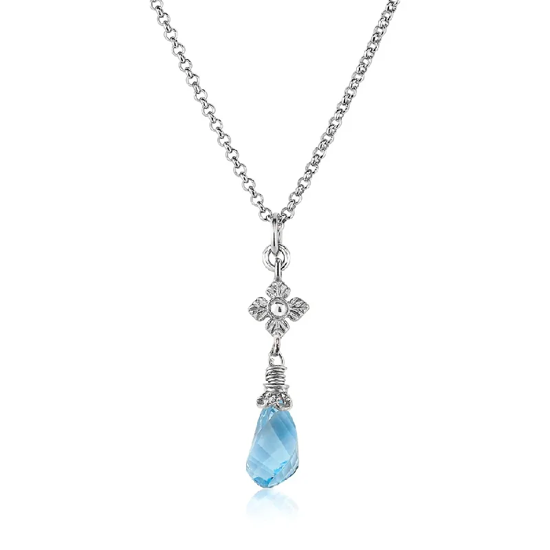 Beautiful necklaces and pendants with geometric shapes for a modern, artistic design-Faceted Blue Topaz Twist Necklace with Flower Detail in Silver