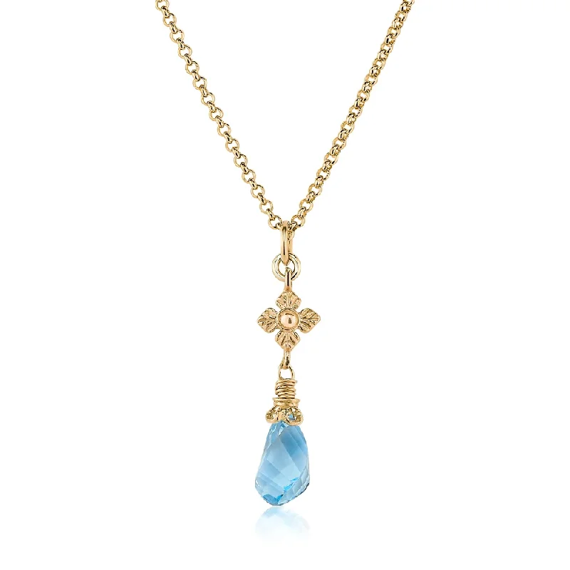 Necklaces and pendants with zodiac constellation designs for an astrological touch-Faceted Blue Topaz Twist Necklace with Flower Detail in Gold